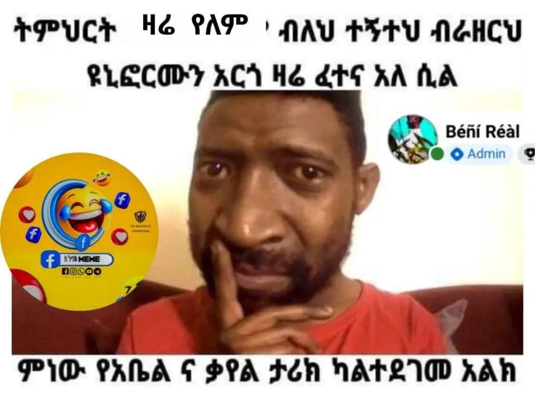 a man in a red shirt is talking to the camera